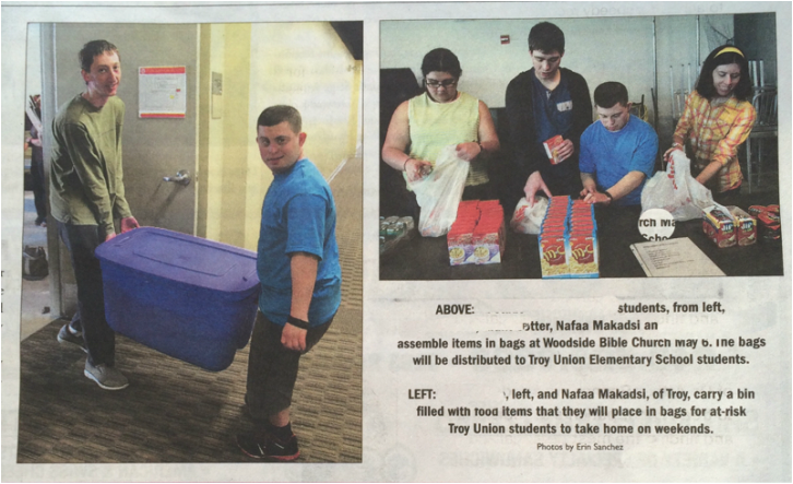 Newspaper Clipping of young people making food bags.